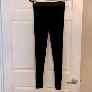 BCBG black sheer back stir-up leggings. Size M